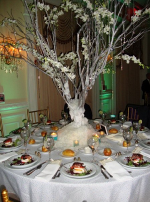  branch centerpieces covered in faux snow for a winter wonderland feel